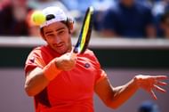Lloyd Harris plays a forehand at French Open